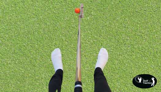 Golfer lining up a shot with GS1 Tour Putter