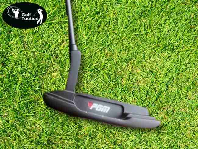 PGM Golf Blade Putter angled on grass