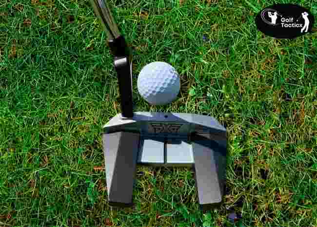 Putter face with alignment aid.